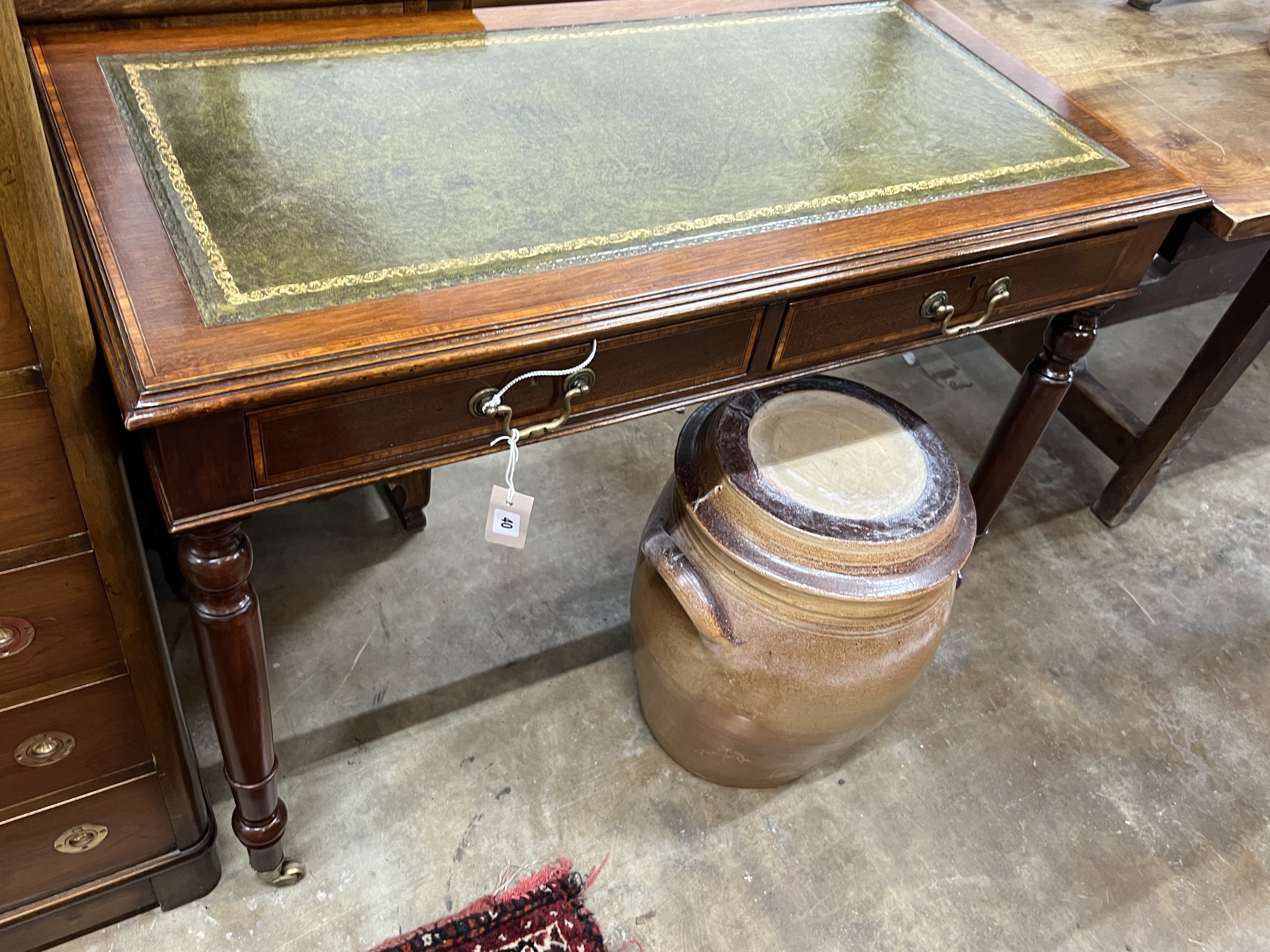 An Edwardian satinwood banded mahogany two drawer writing table, width 102cm, depth 52cm, height 78cm